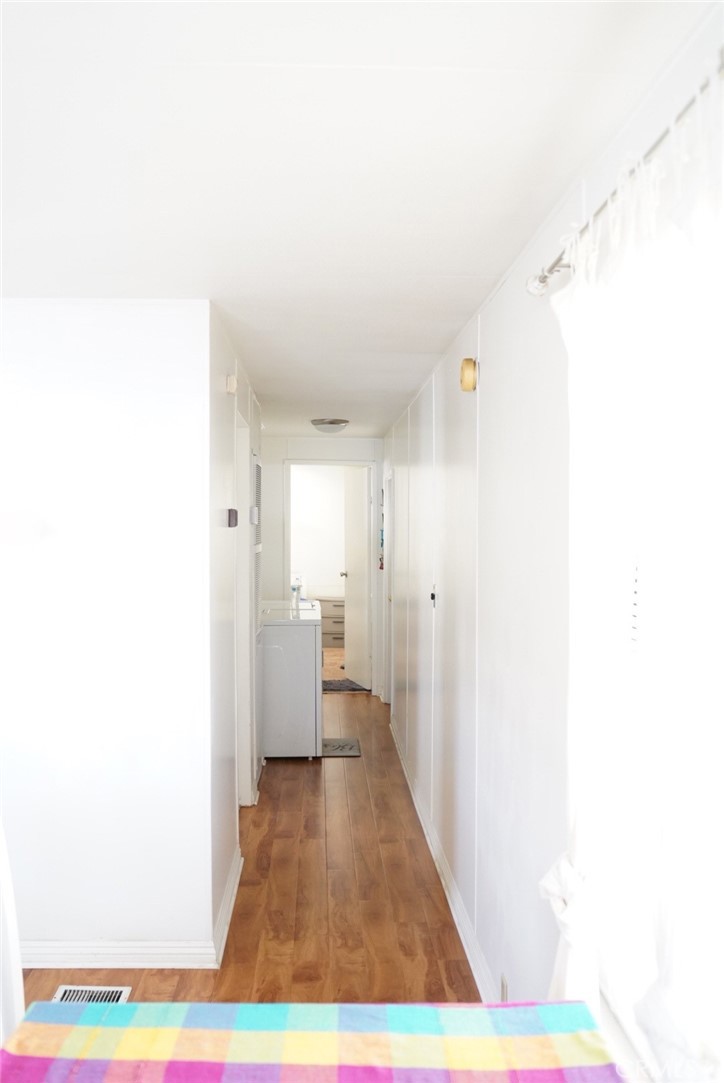 1010 Terrace Road, Unit 38 San Bernardino, CA 92410 - Photo 13 of 16 a view of a room with wooden floor