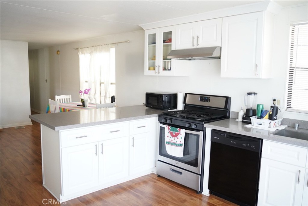 1010 Terrace Road, Unit 38 San Bernardino, CA 92410 - Photo 2 of 16 a kitchen with stainless steel appliances granite countertop a sink stove and refrigerator