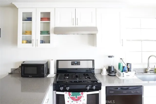 a kitchen with a stove and a sink
