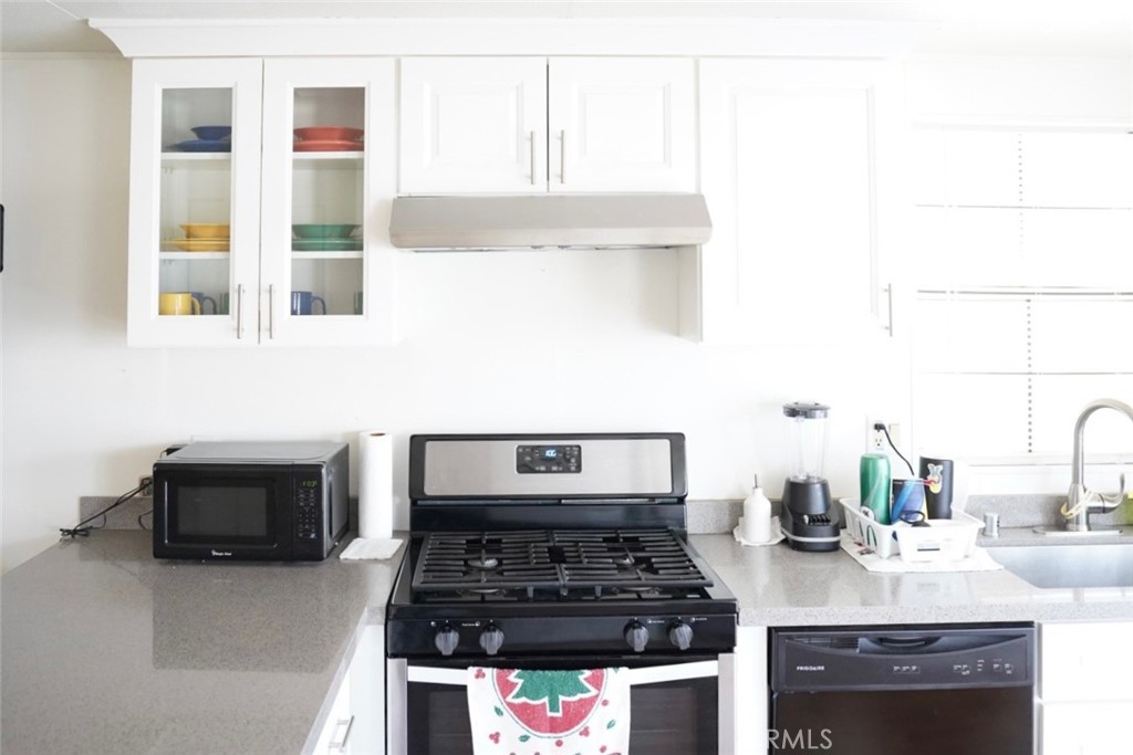 1010 Terrace Road, Unit 38 San Bernardino, CA 92410 - Photo 4 of 16 a kitchen with a stove and a sink