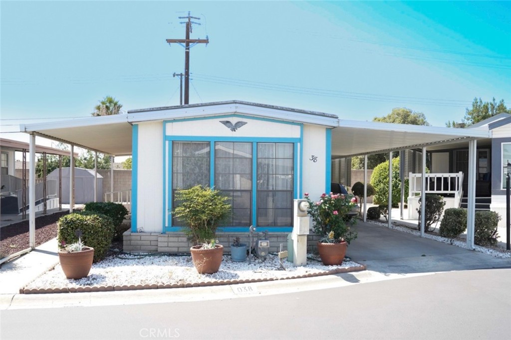 1010 Terrace Road, Unit 38 San Bernardino, CA 92410 - Photo 5 of 16 a front view of a house with porch