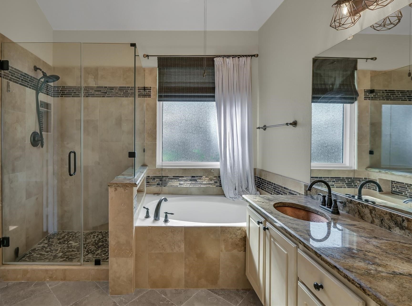 30 South Rambling Ridge Place Conroe, TX 77385 - Photo 7 of 15 a bathroom with double vanity sink and mirror