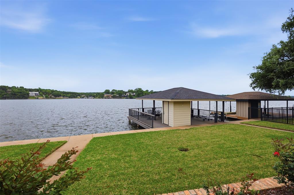 2406 River Road Granbury, TX 76048 - Photo 29 of 40 a house view with a lake view