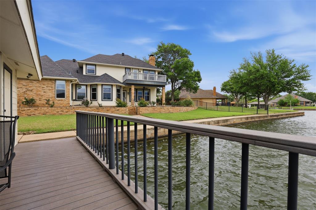 2406 River Road Granbury, TX 76048 - Photo 30 of 40 a view of a house with a yard and deck