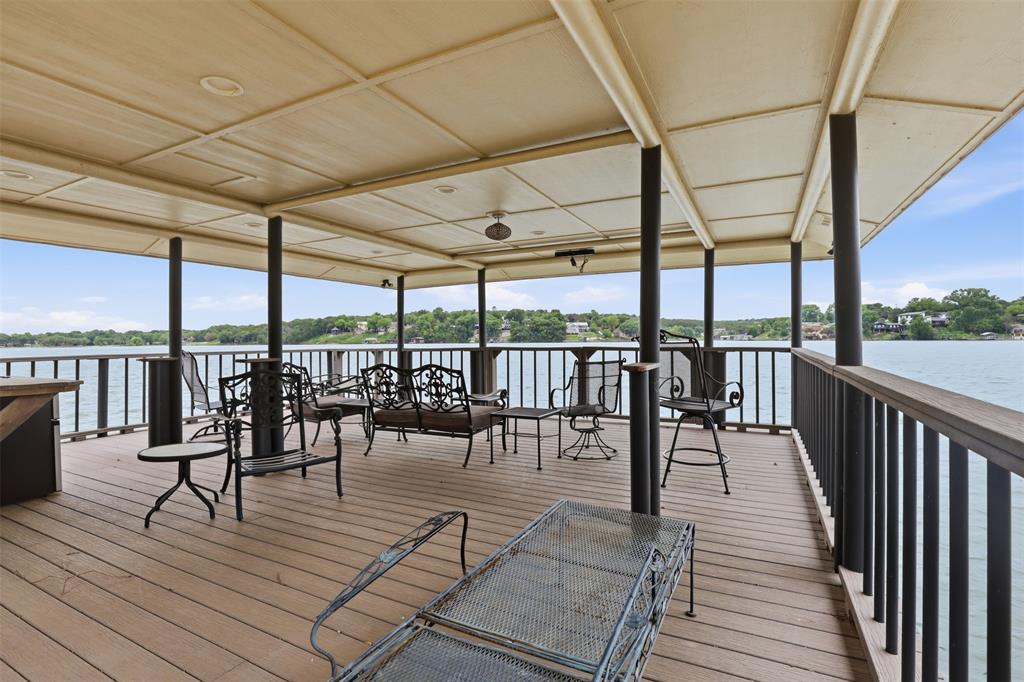 2406 River Road Granbury, TX 76048 - Photo 31 of 40 a view of a swimming pool with outdoor seating