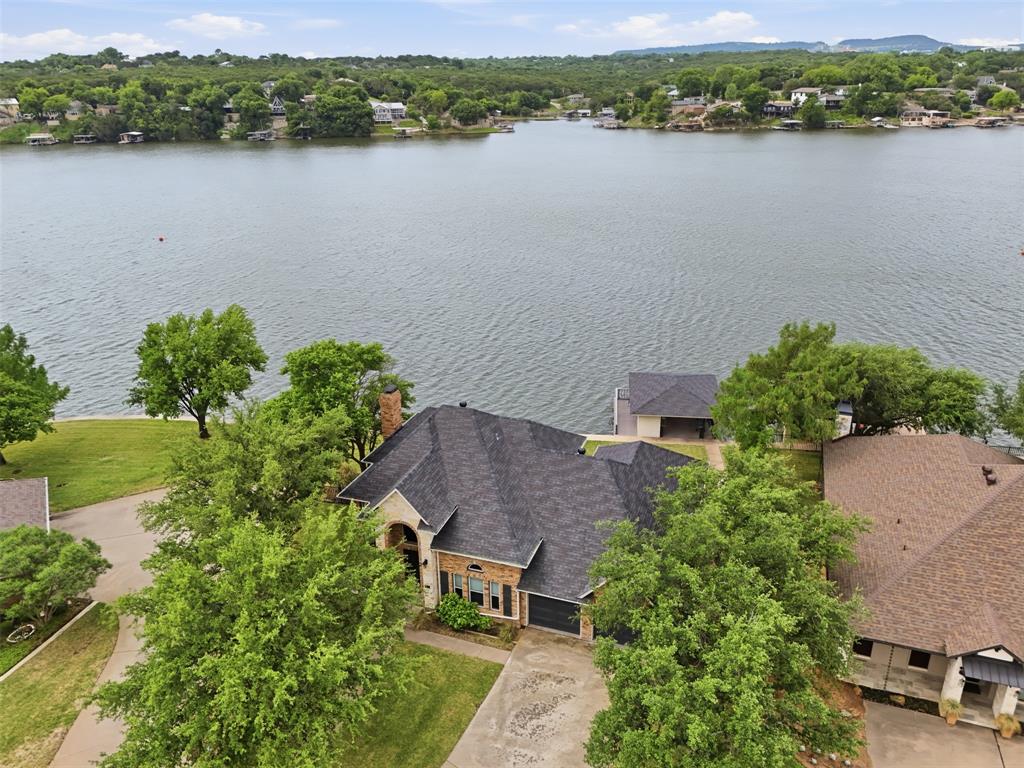 2406 River Road Granbury, TX 76048 - Photo 34 of 40 an aerial view of a house with a lake view