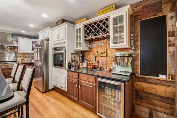 a kitchen with stainless steel appliances granite countertop a stove and a sink