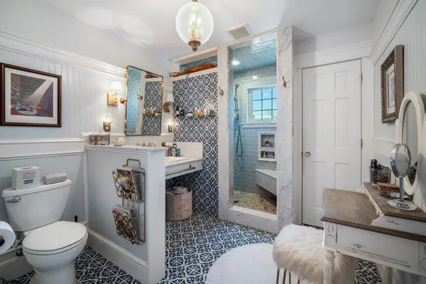 a bathroom with a sink a mirror and a bathtub