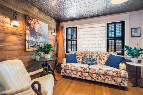 a living room with furniture rug and window