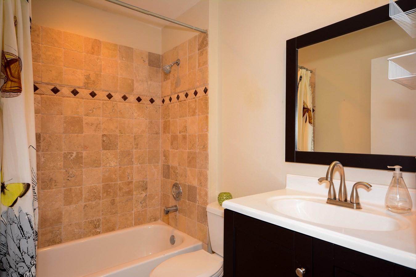 6896 Long Key Street Lake Worth, FL 33467 - Photo 12 of 18 a bathroom with a sink and a mirror