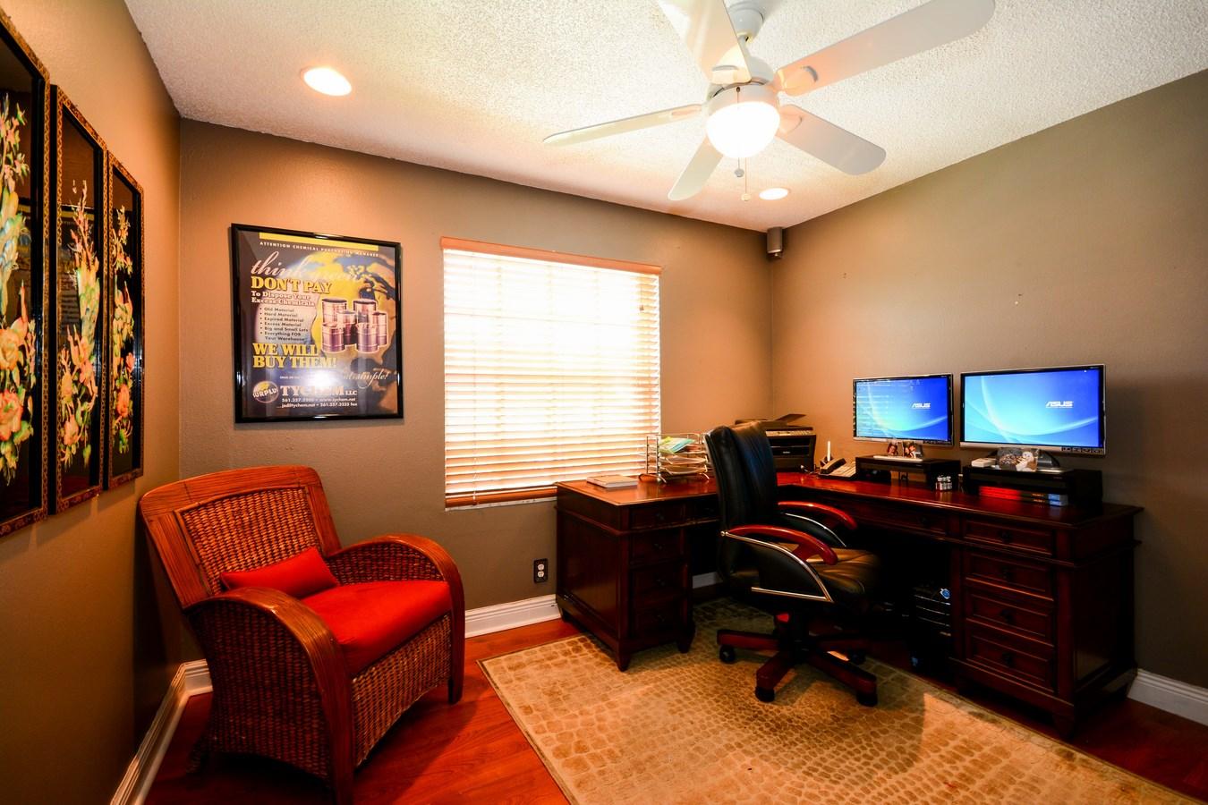 6896 Long Key Street Lake Worth, FL 33467 - Photo 13 of 18 a livingroom with workspace and a couch