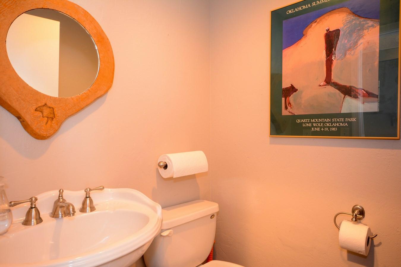 6896 Long Key Street Lake Worth, FL 33467 - Photo 15 of 18 a bathroom with a toilet sink and mirror