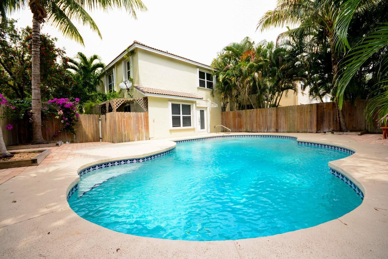 6896 Long Key Street Lake Worth, FL 33467 - Photo 17 of 18 a view of a house with a backyard