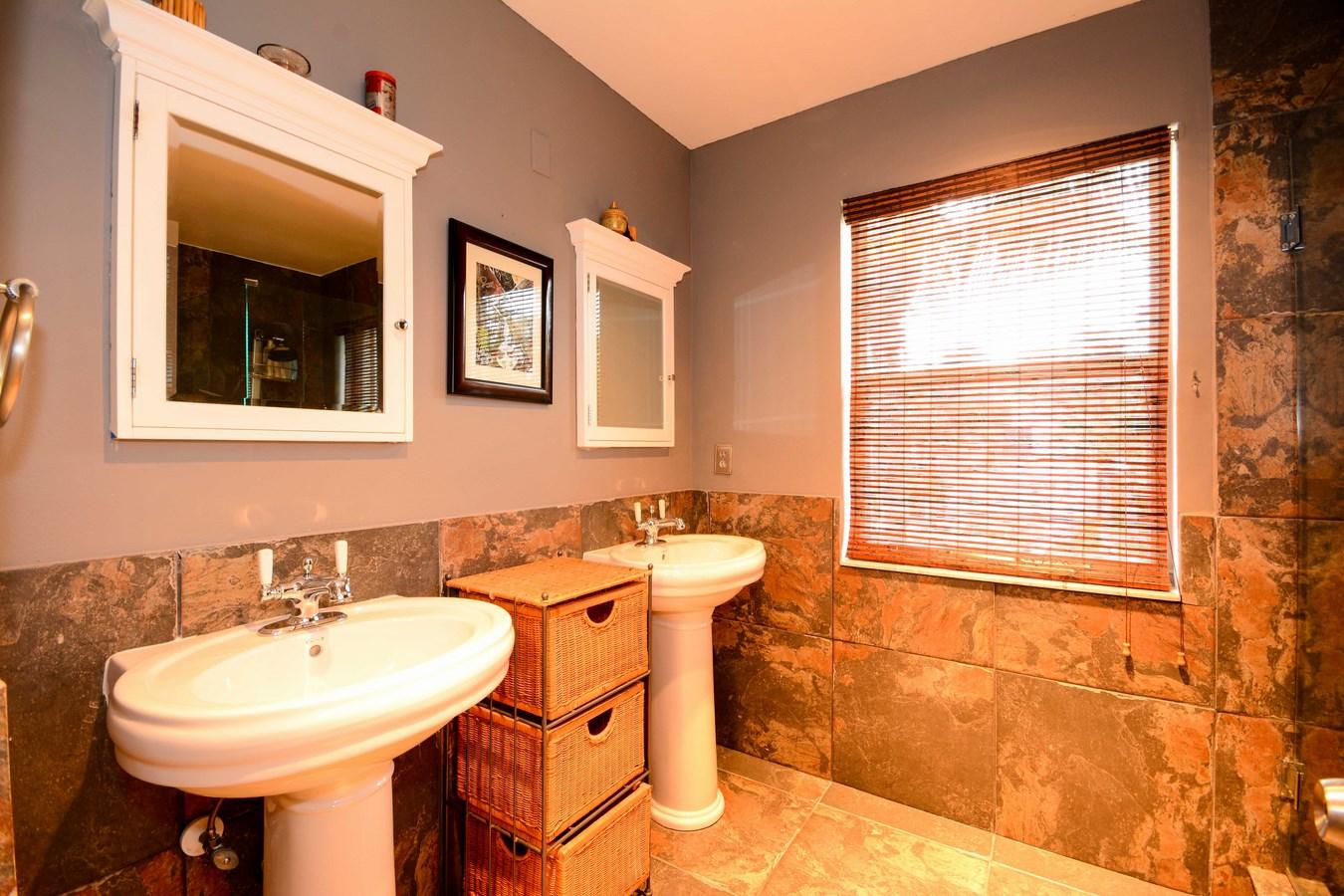 6896 Long Key Street Lake Worth, FL 33467 - Photo 10 of 18 a bathroom with a sink and a mirror
