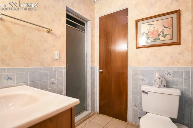 a bathroom with a toilet sink and tub