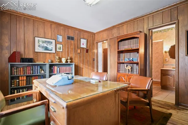 a room with furniture and a book shelf