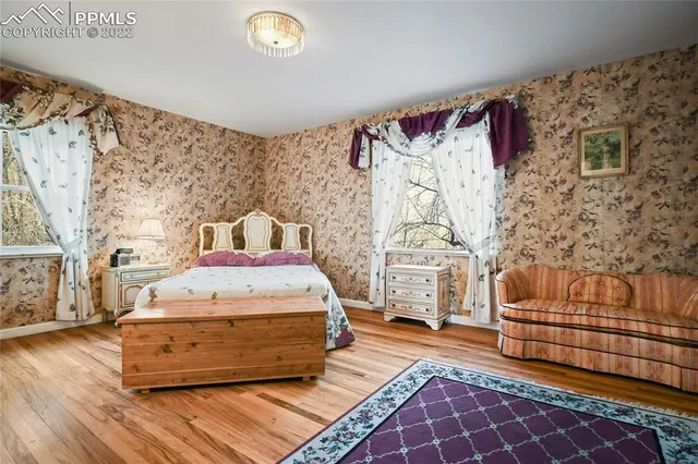 a bedroom with a bed and a couch