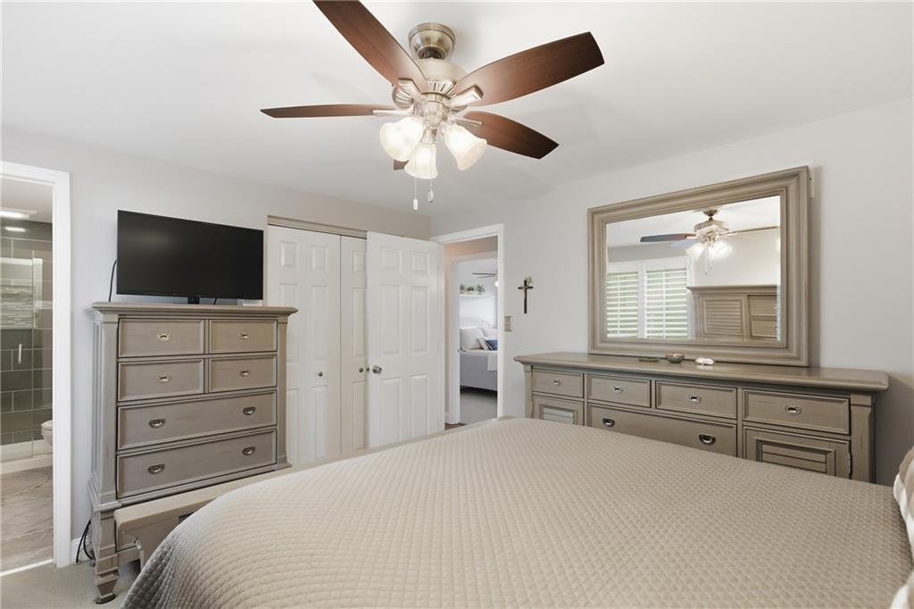 2955 Kings Mill Road Bethel Park, PA 15102 - Photo 13 of 40 a bedroom with a bed and a flat screen tv