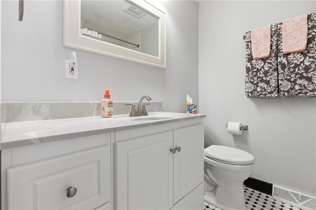 2955 Kings Mill Road Bethel Park, PA 15102 - Photo 18 of 40 a bathroom with a sink toilet and vanity
