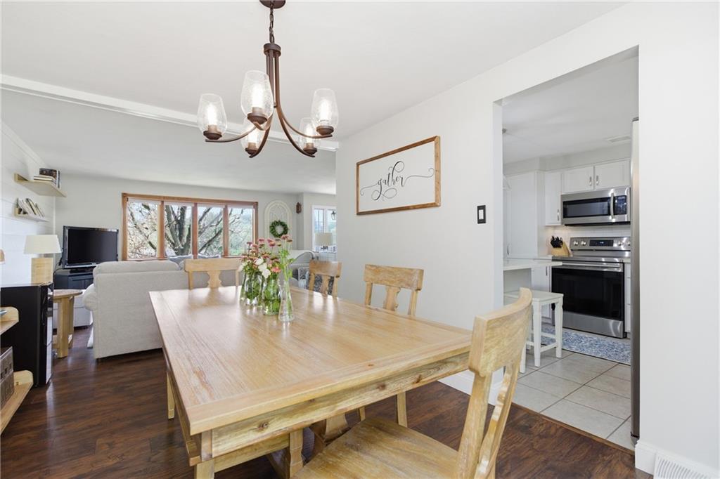 2955 Kings Mill Road Bethel Park, PA 15102 - Photo 7 of 40 a view of a dining room with furniture window and wooden floor