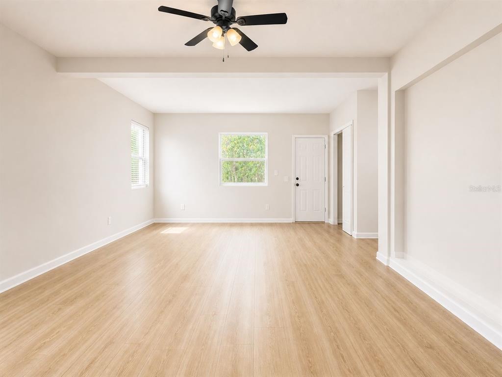 1353 Lakeview Road Clearwater, FL 33756 - Photo 13 of 15 wooden floor in an empty room