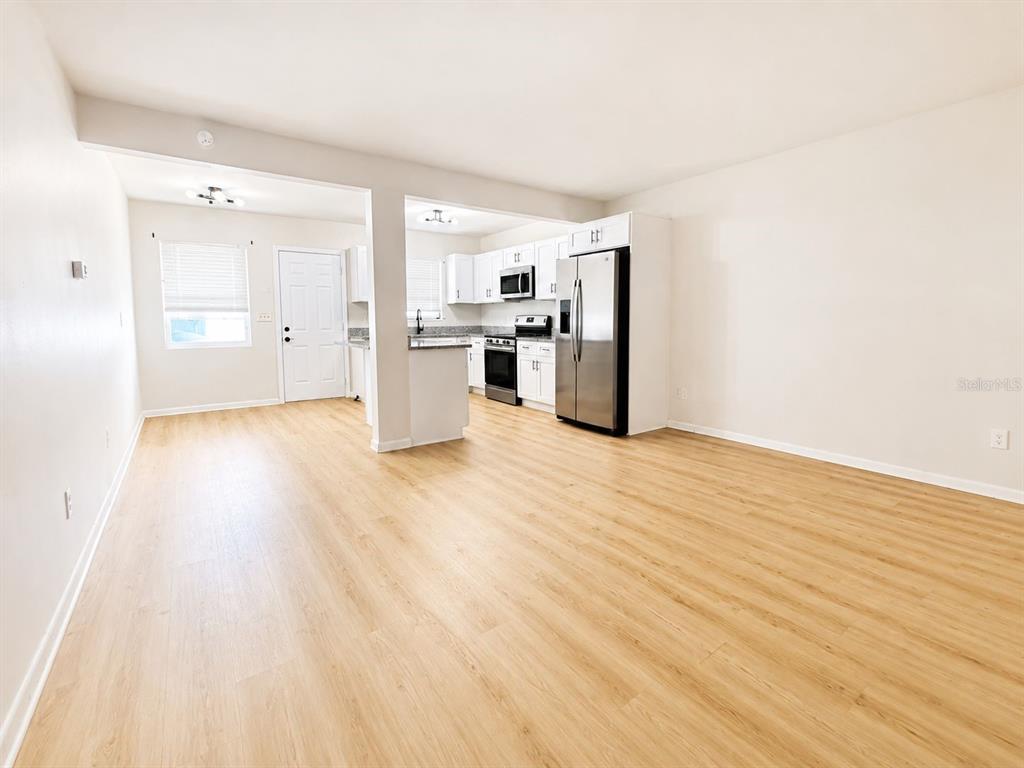 1353 Lakeview Road Clearwater, FL 33756 - Photo 3 of 15 a view of a kitchen with wooden floor