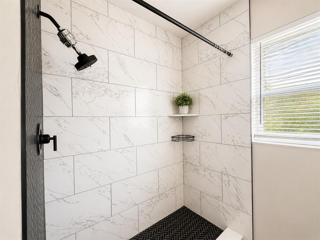1353 Lakeview Road Clearwater, FL 33756 - Photo 9 of 15 a bathroom with a shower