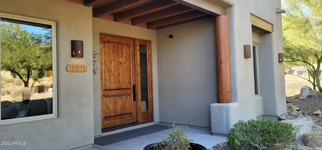 a view of a backyard with sitting area and furniture