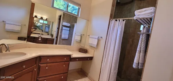 a bathroom with a sink a mirror and vanity