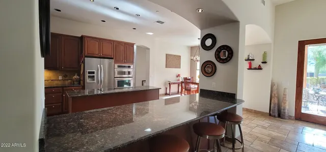 a dining room with furniture and window