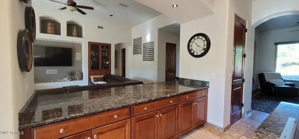 a hallway with sink and mirror