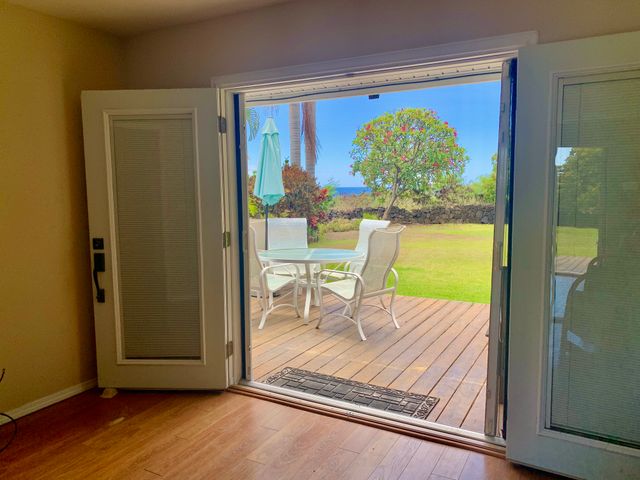 a view of a room with a table and chairs