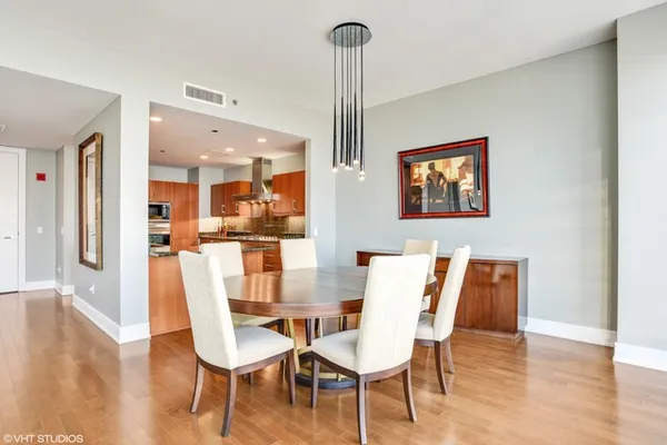 a dining room with furniture and window