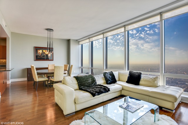 401 North Wabash Avenue, Unit 80B Chicago, IL 60611 - Photo 6 of 34 a living room with furniture and a large window