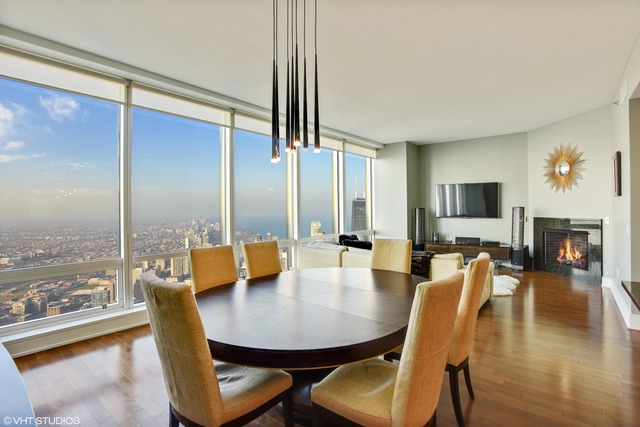 401 North Wabash Avenue, Unit 80B Chicago, IL 60611 - Photo 7 of 34 a view of a dining room with furniture and wooden floor