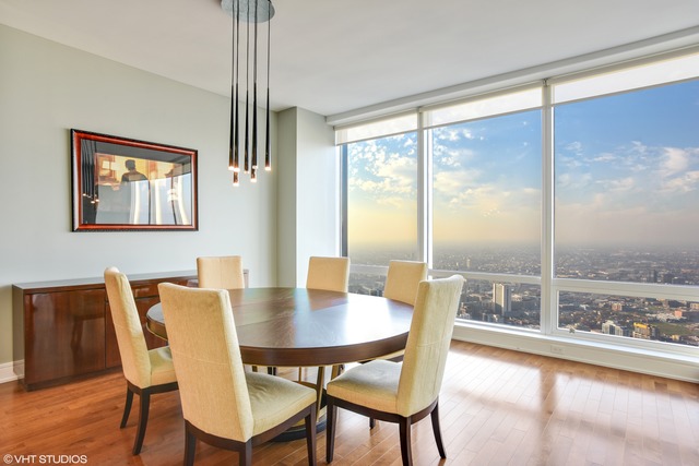 401 North Wabash Avenue, Unit 80B Chicago, IL 60611 - Photo 10 of 34 a view of a dining room with furniture and window