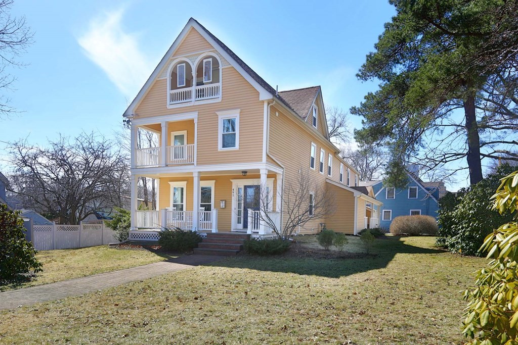 491 Webster Street Needham, MA 02494 - Photo 1 of 37 a front view of a house with a yard and garage