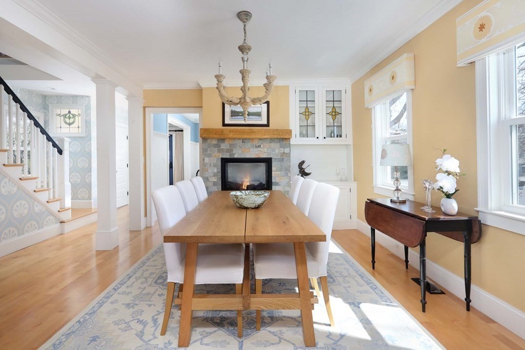 491 Webster Street Needham, MA 02494 - Photo 12 of 37 a living room with furniture a fireplace and a table