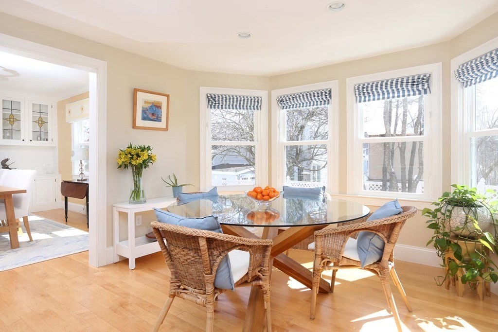 491 Webster Street Needham, MA 02494 - Photo 13 of 37 a dining room with furniture and large windows