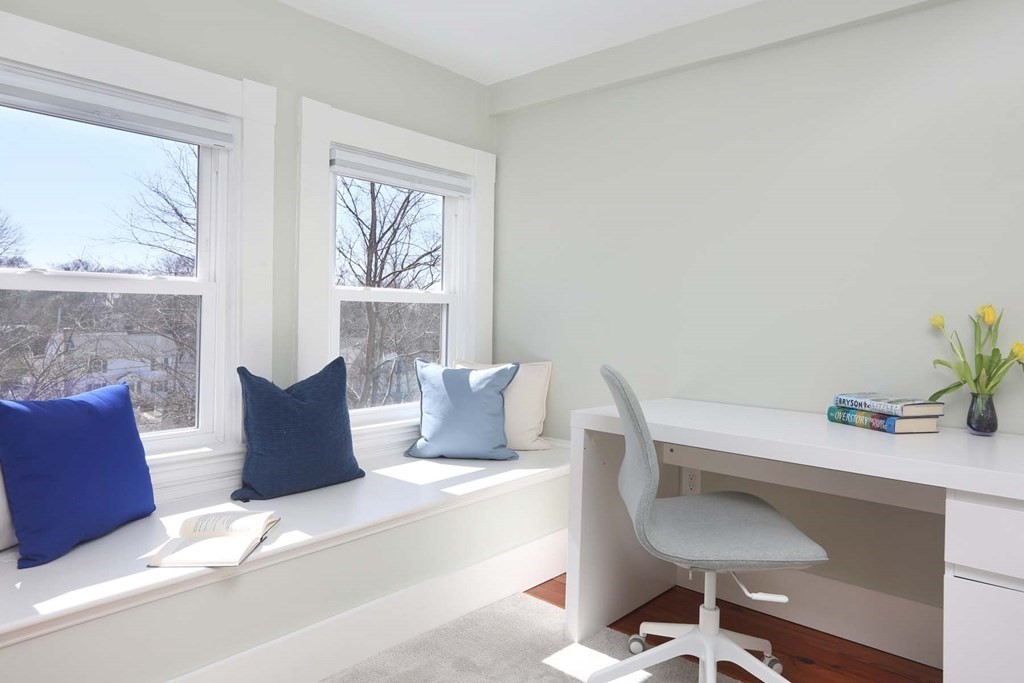 491 Webster Street Needham, MA 02494 - Photo 23 of 37 a living room with furniture and a large window