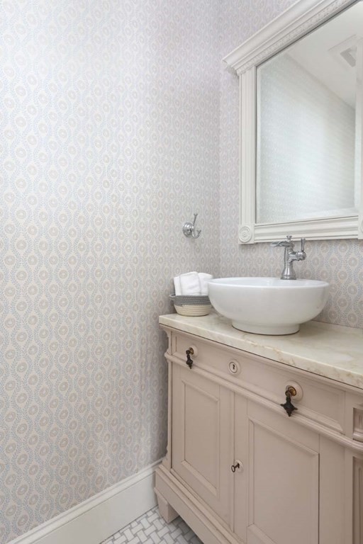 491 Webster Street Needham, MA 02494 - Photo 28 of 37 a bathroom with a sink and a mirror