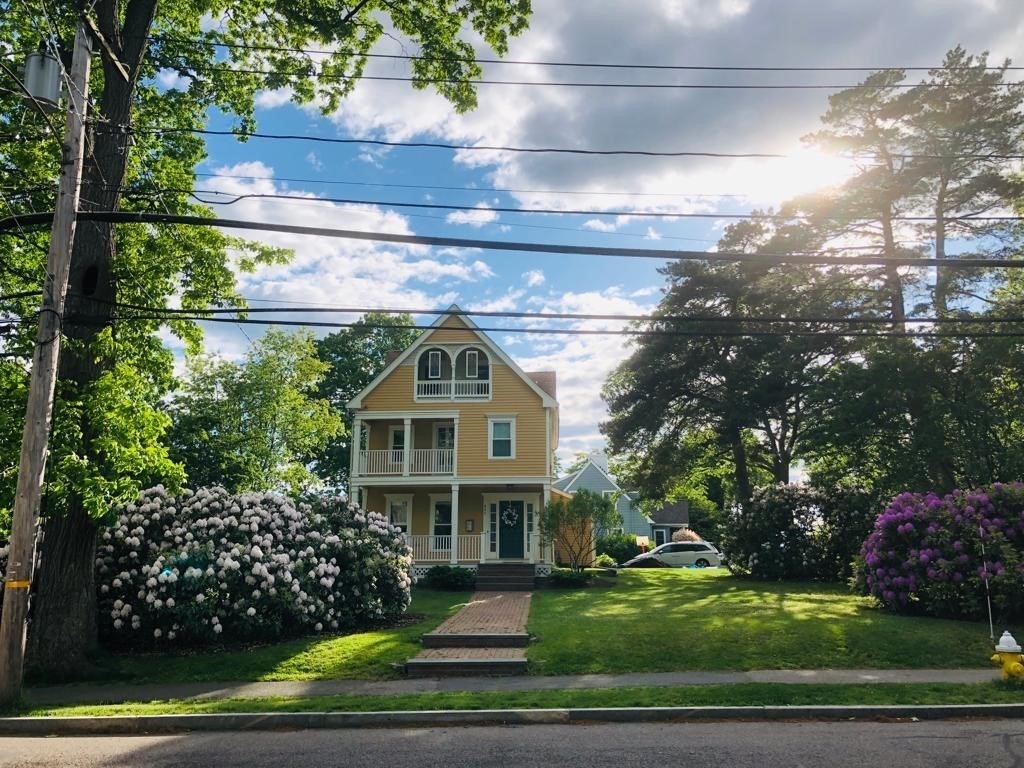 491 Webster Street Needham, MA 02494 - Photo 33 of 37 a front view of a house with a garden