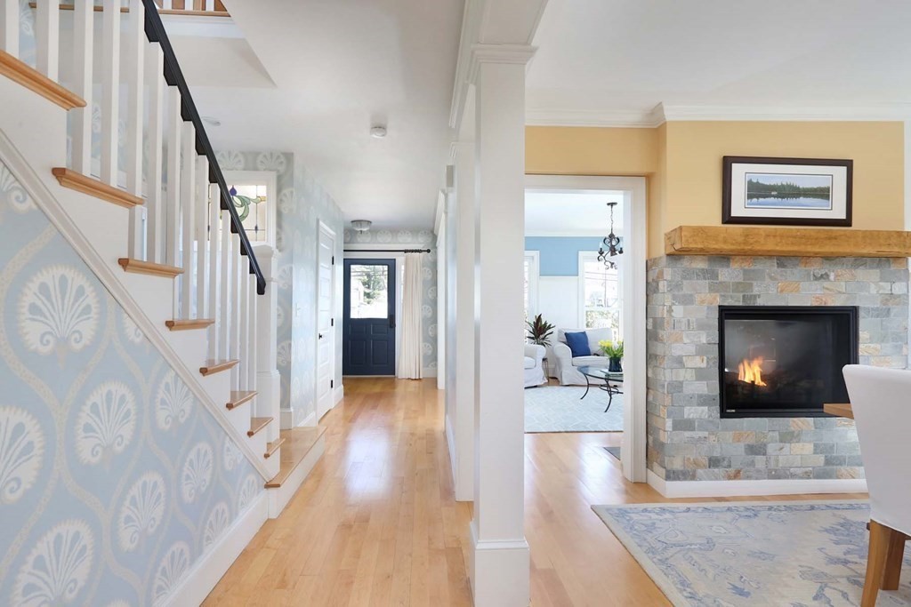 491 Webster Street Needham, MA 02494 - Photo 7 of 37 a living room with furniture and a fireplace