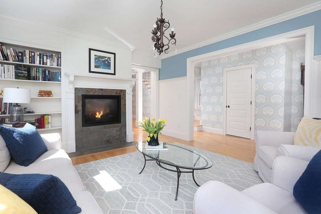 491 Webster Street Needham, MA 02494 - Photo 9 of 37 a living room with furniture and a fireplace