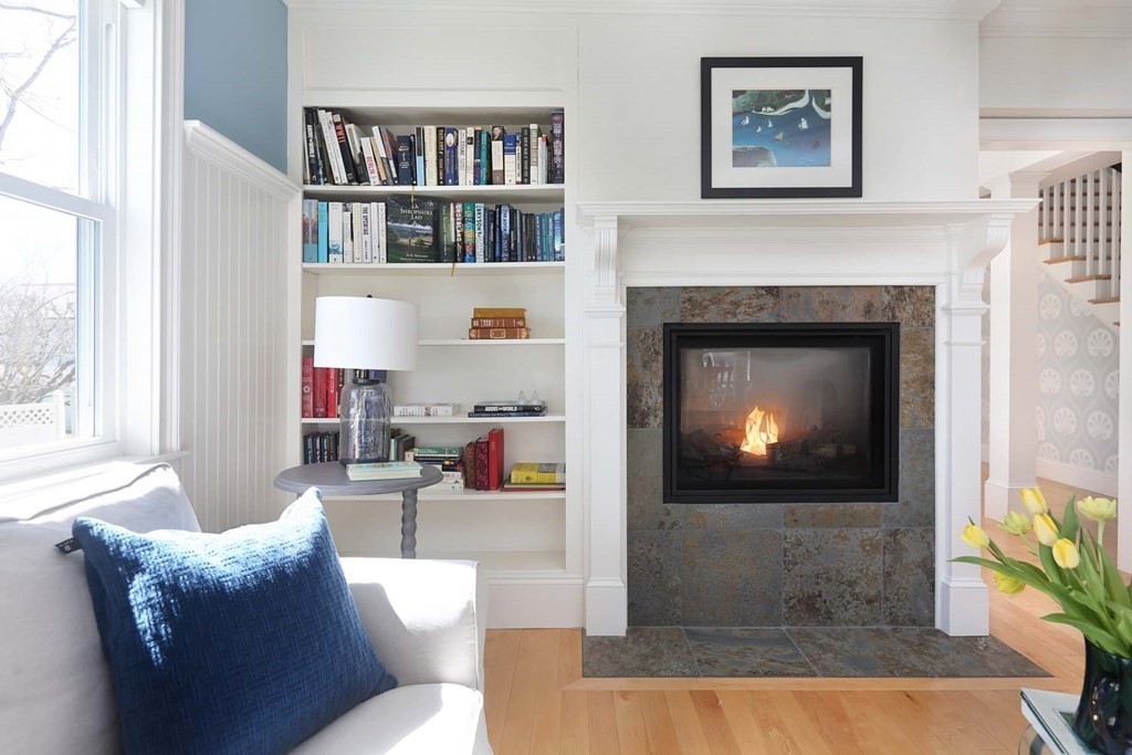 491 Webster Street Needham, MA 02494 - Photo 10 of 37 a living room with furniture and a fireplace