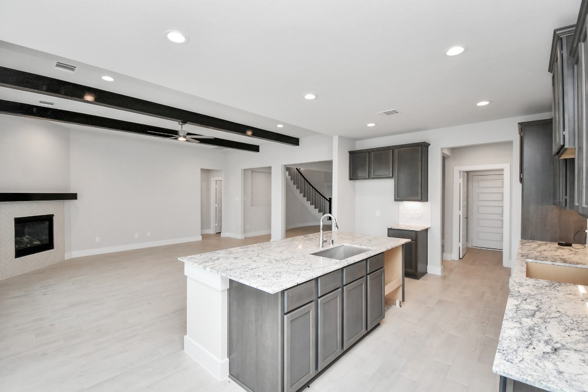 3123 Native Spg Drive Spring, TX 77373 - Photo 13 of 38 All of this overlooks your expansive family room, creating a perfect space for culinary delights and family gatherings. Sample photo of completed home with similar floor plan. Actual colors and selections may vary.