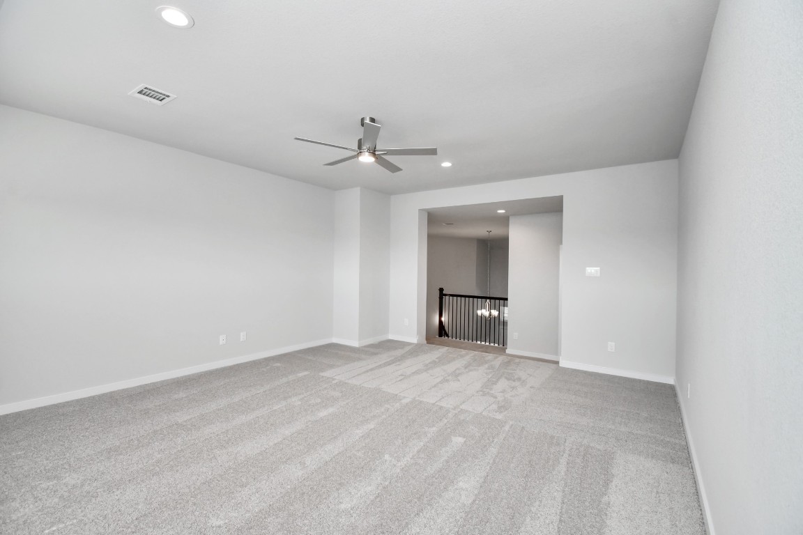 3123 Native Spg Drive Spring, TX 77373 - Photo 27 of 38 Come upstairs and enjoy a day of leisure in this fabulous game room! This is the perfect hangout spot or adult game room! Features plush carpet, high ceilings, custom paint and windows for plenty of natural light. Sample photo of completed home with similar floor plan. Actual colors and selections may vary.