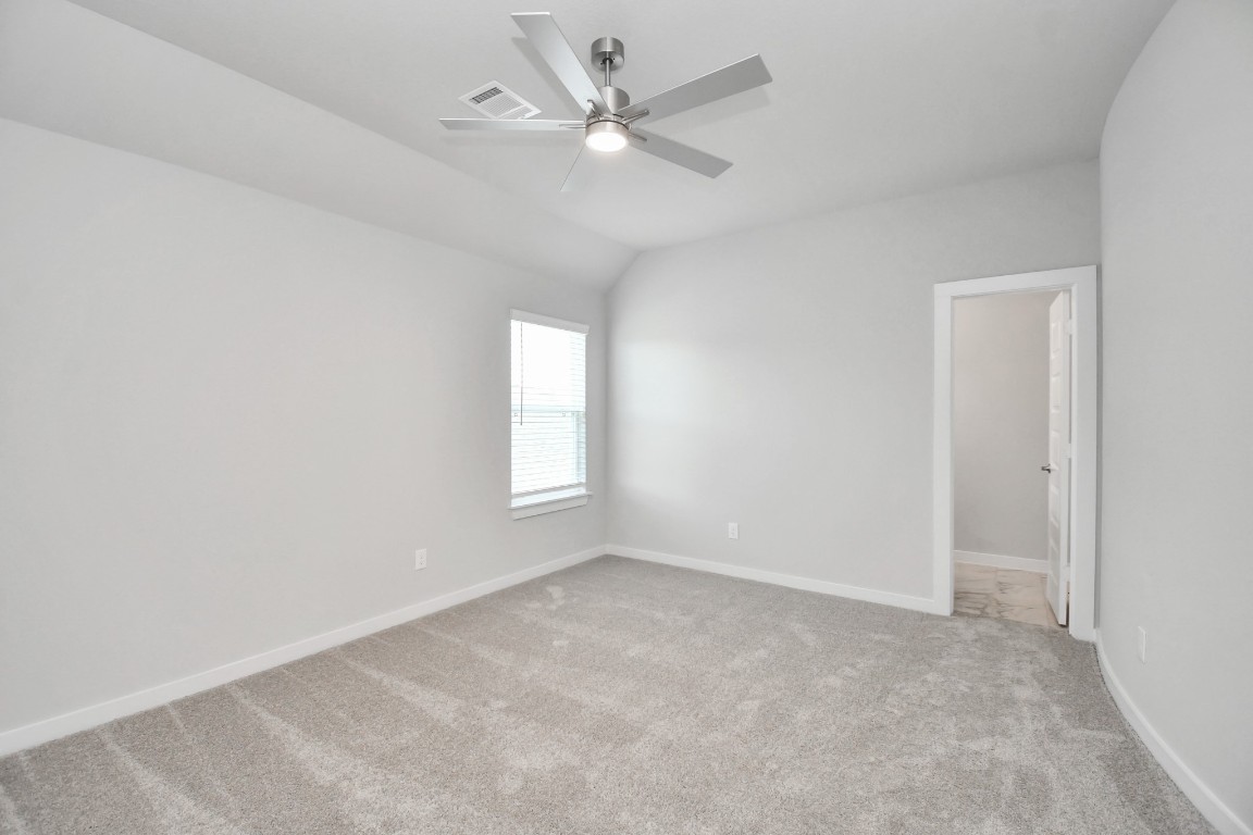 3123 Native Spg Drive Spring, TX 77373 - Photo 35 of 38 Generously sized secondary bedrooms featuring spacious closets, soft and inviting carpeting underfoot, large windows allowing plenty of natural light, and the added touch of privacy blinds for your personal retreat. Sample photo of completed home with similar floor plan. Actual colors and selections may vary.