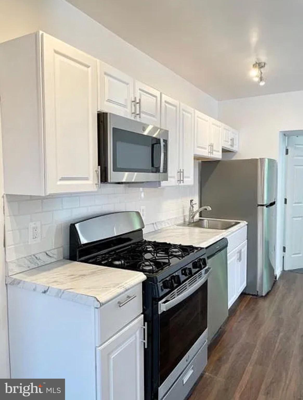 5822 9th Street Northwest, Unit 4 Washington, DC 20011 - Photo 2 of 10 Modern kitchen with sleek finishes.