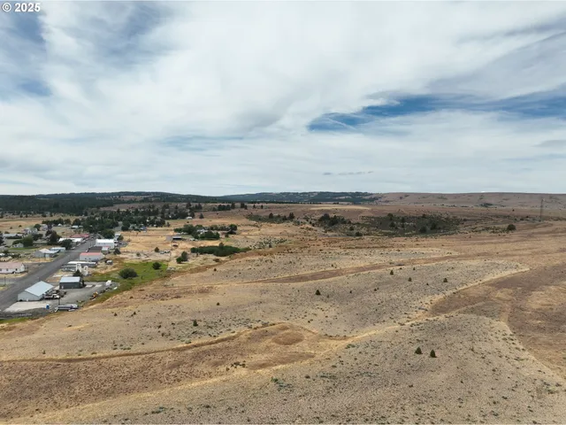 an aerial view of beach and city